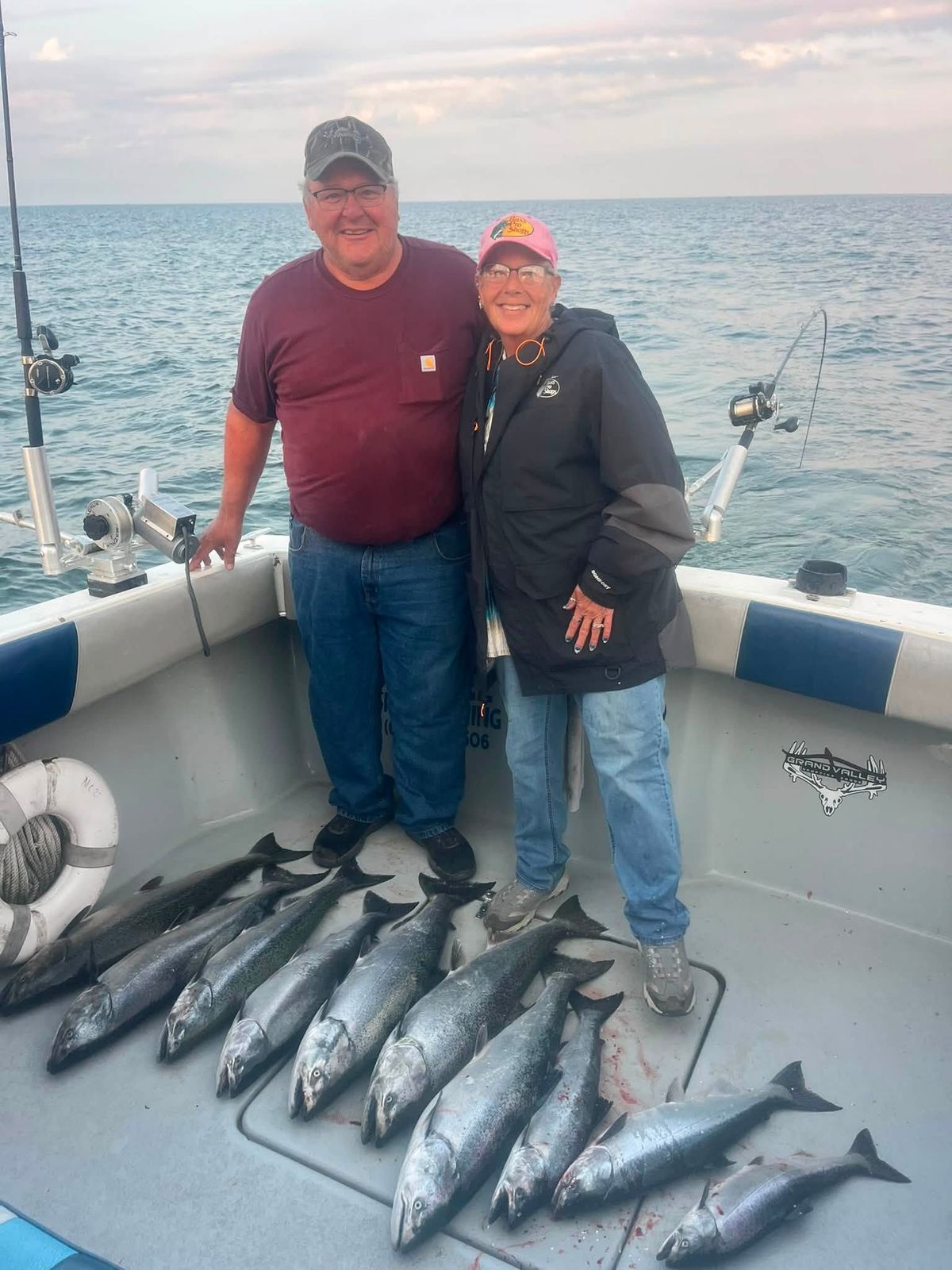 Two anglers pose with their catch of mackerel on the charter boat