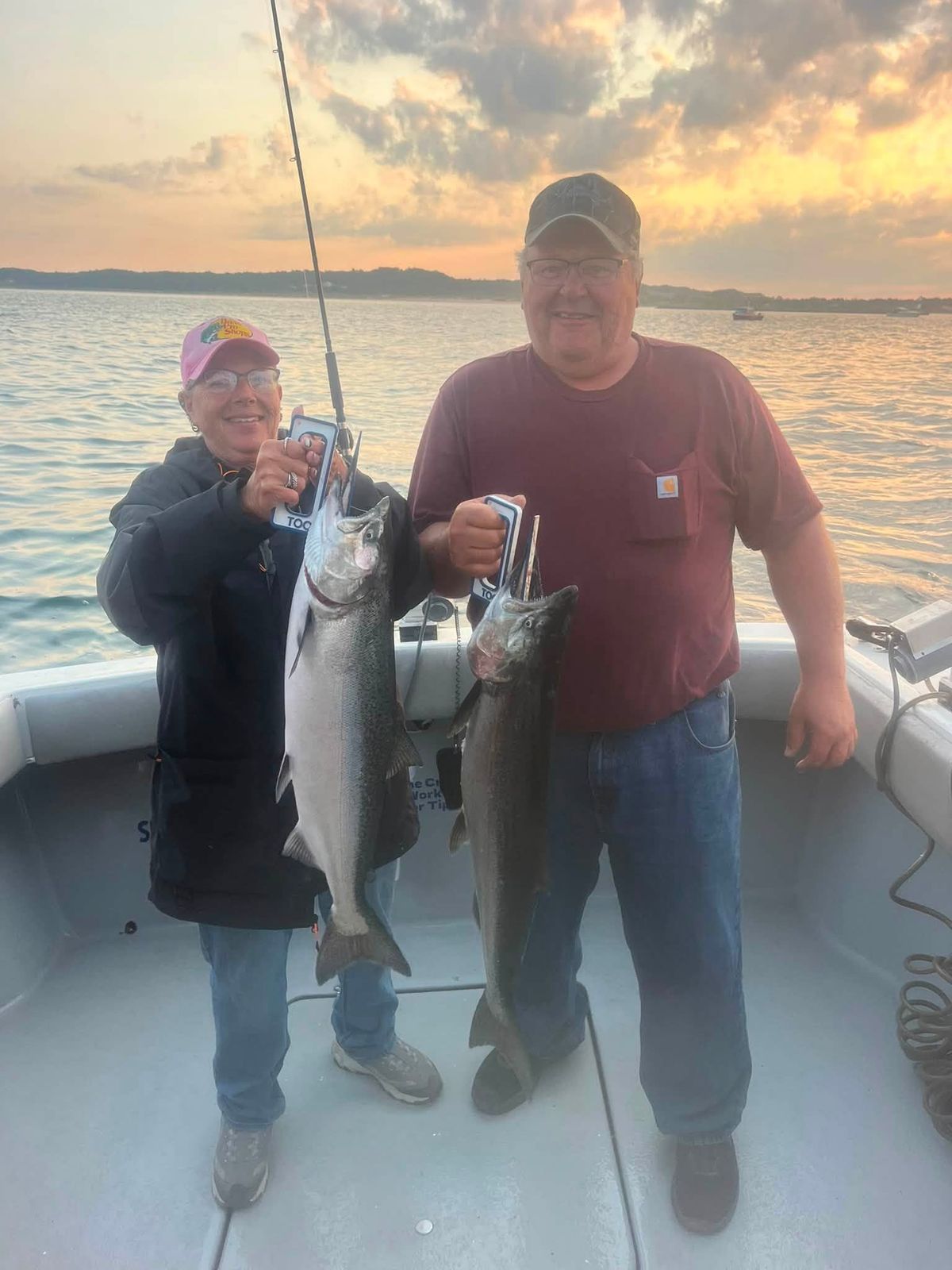 Captain Anthony Sova and a young angler display their lake trout aboard the Cherokee
